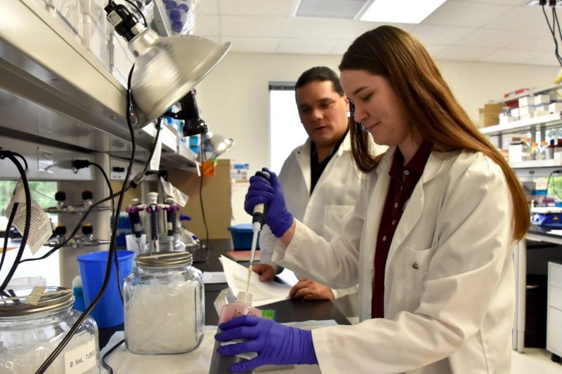 Mike Bowers and undergraduate researcher Makenzlie Taylor in his lab