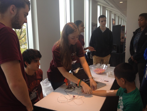 Neuroscience Club sets up a booth at Virginia Science Festival to educate children on the action potentials in their muscles.